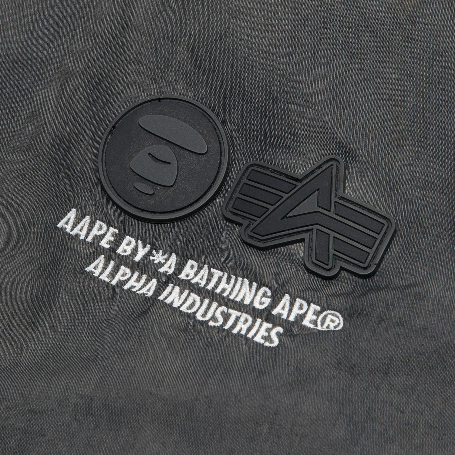 AAPE X ALPHA INDUSTRIES MOONFACE LOGO HOODED BOMBER JACKET