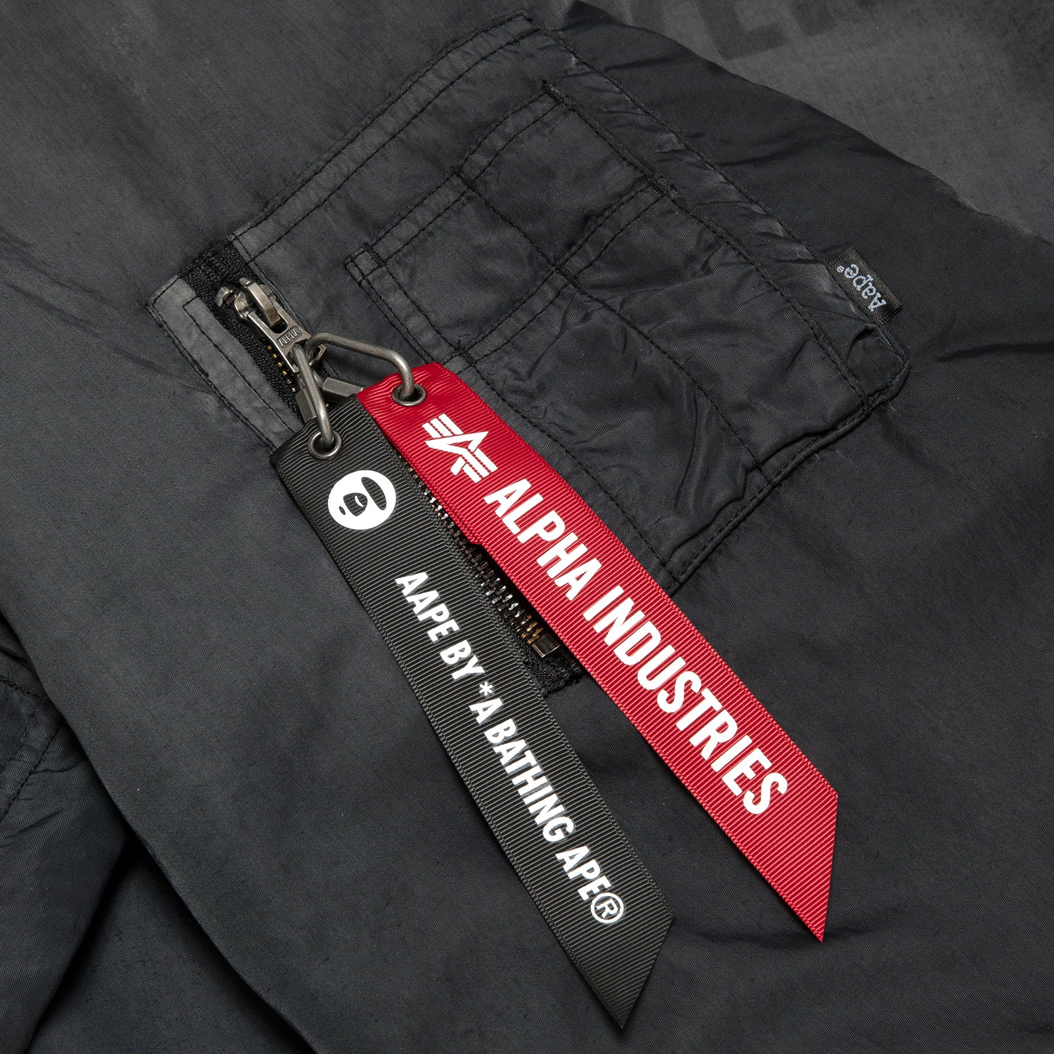 AAPE X ALPHA INDUSTRIES MOONFACE LOGO HOODED BOMBER JACKET