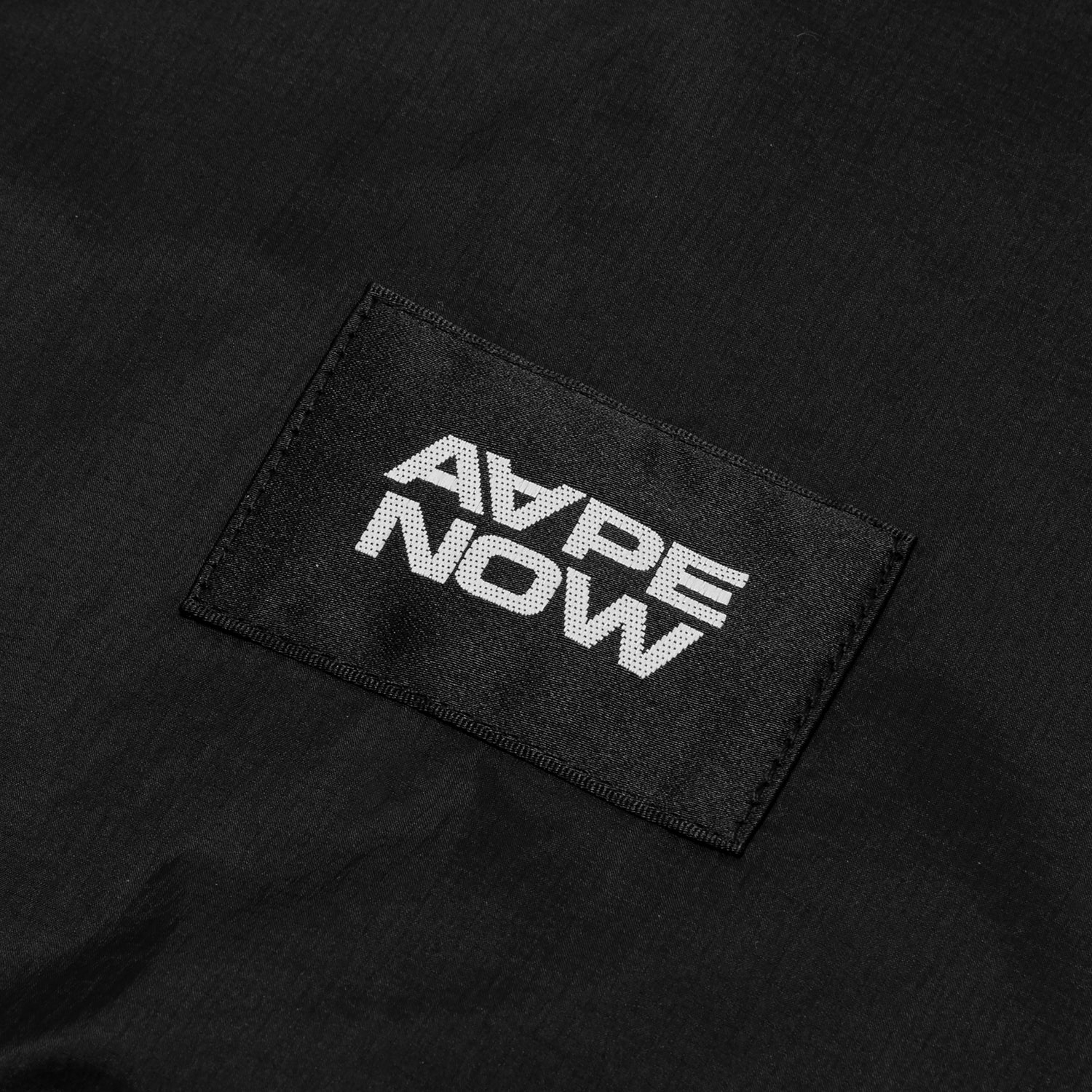 AAPLJM7704XXO/AAPENOW MOONFACE LOGO WINDBREAKER JACKET
