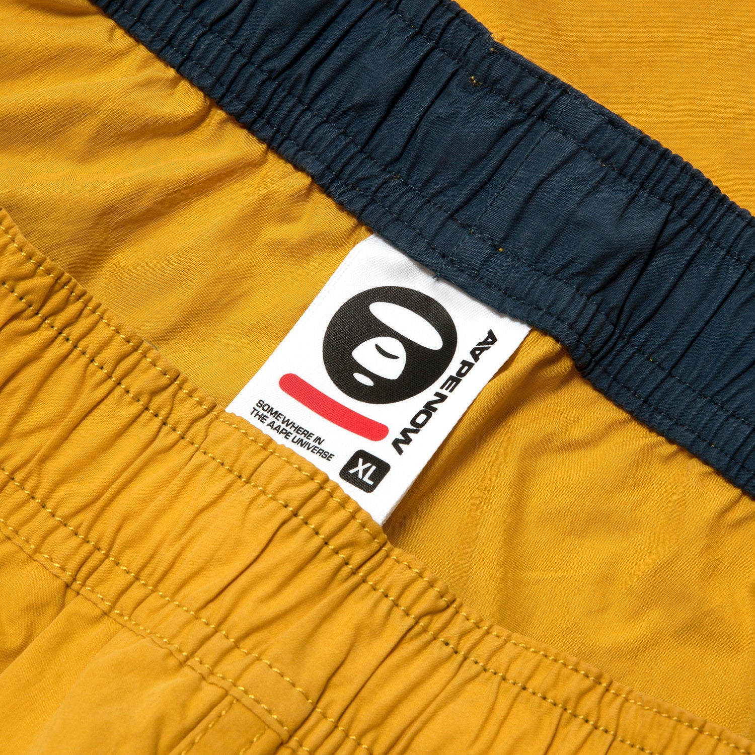 AAPSPMB673XXO/AAPENOW MOONFACE LOGO SHORTS