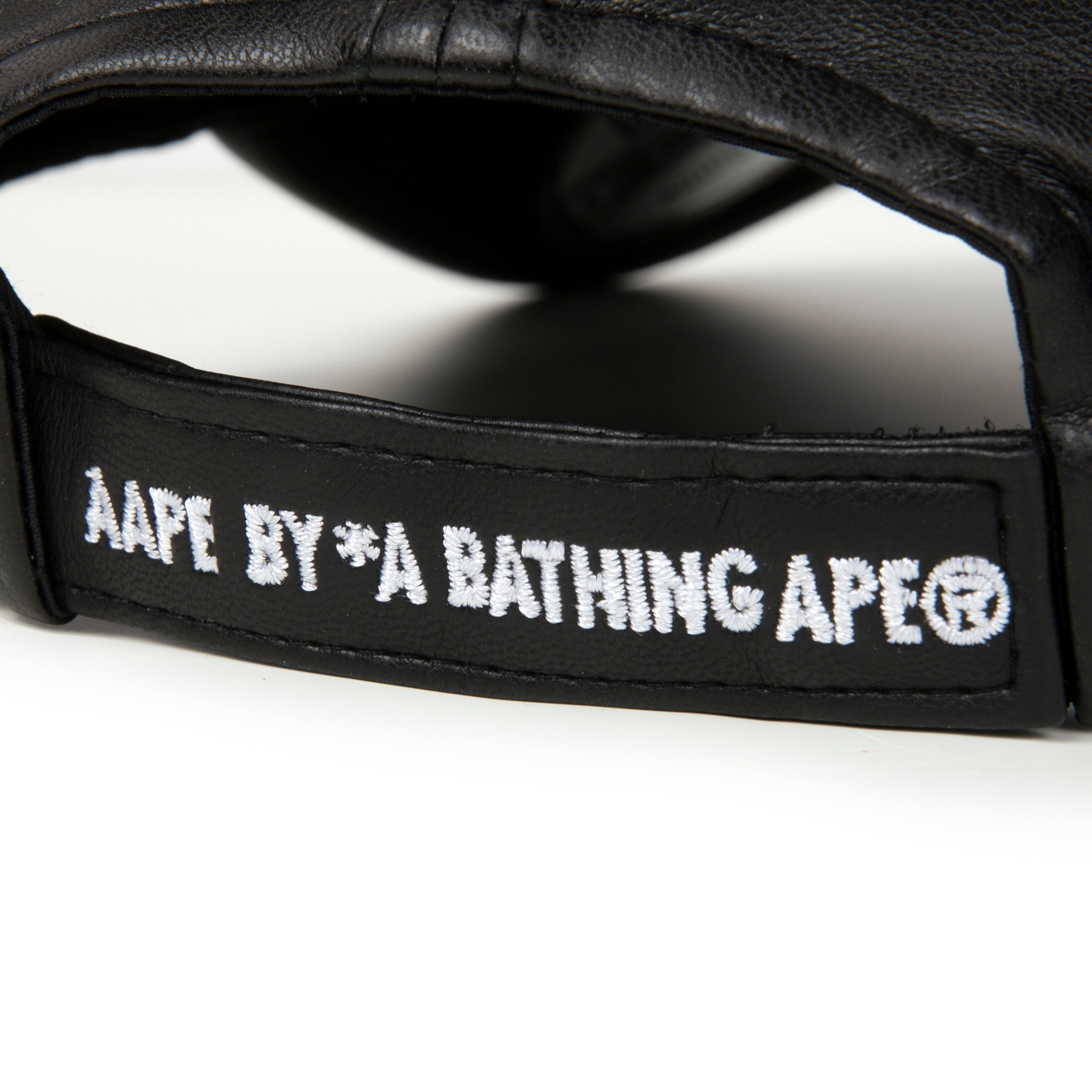 AAPE X NEW ERA 10TH ANNIVERSARY MOONFACE FAUX LEATHER CAP