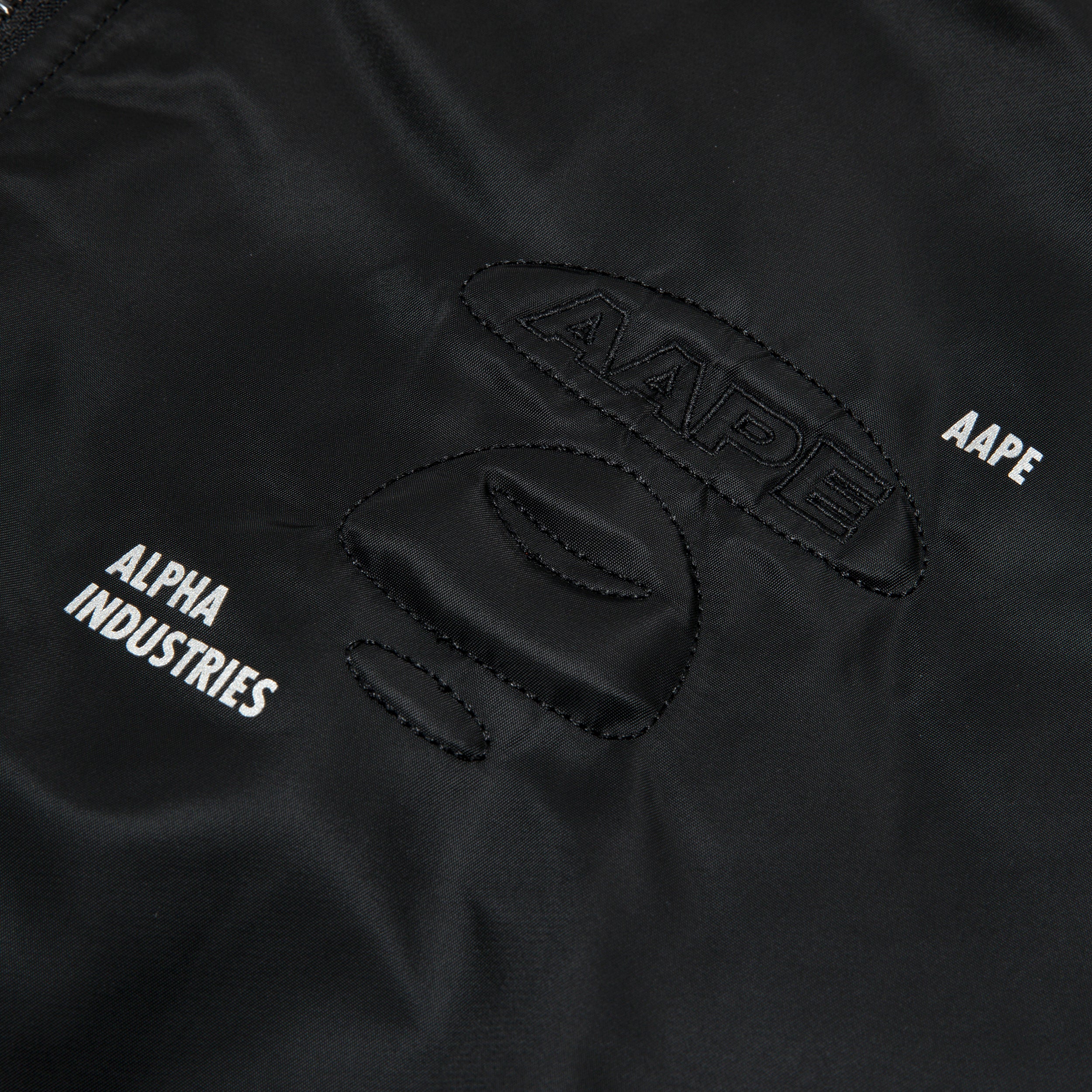 AAPE X ALPHA INDUSTRIES MOONFACE EMBOSSED BOMBER JACKET