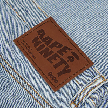 AAPE X 9090 STYLE MOONFACE PATCH DISTRESSED JEANS