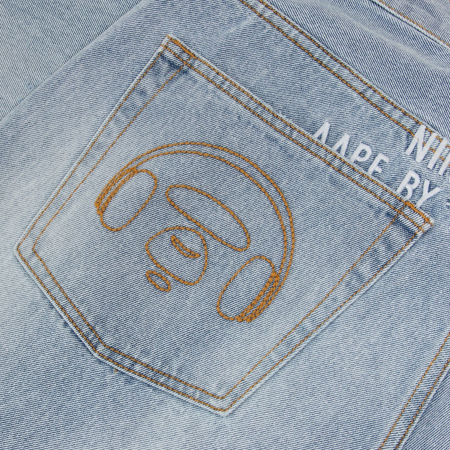 AAPE X 9090 STYLE MOONFACE PATCH DISTRESSED JEANS