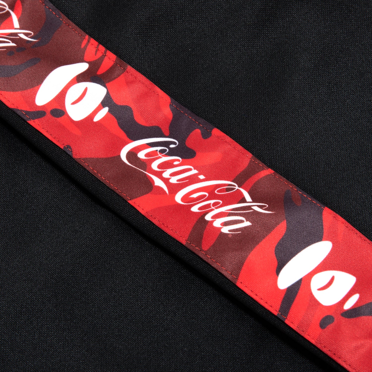 AAPE X COCA-COLA MOONFACE PATCH TRACK PANTS