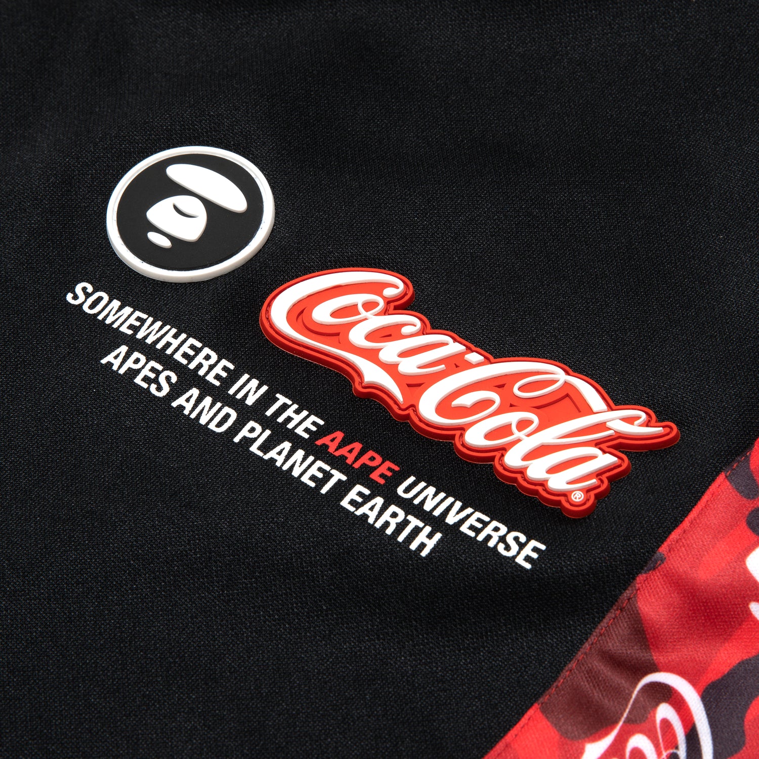 AAPE X COCA-COLA MOONFACE PATCH TRACK PANTS